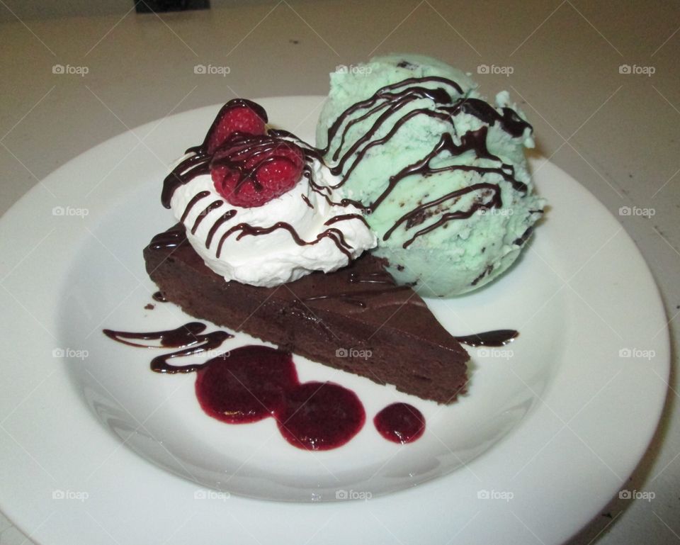 Flourless chocolate cake with mint chocolate chip ice cream