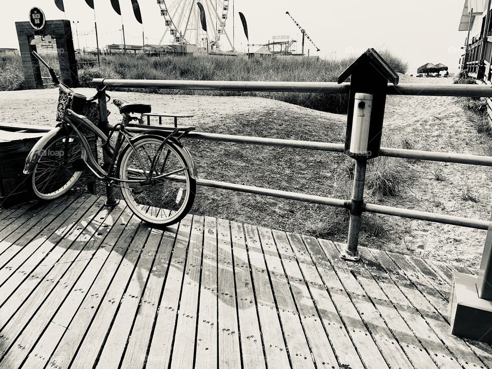 This black and white photo has a cool bike and has the beautiful Atlantic City Pier behind. This is a vintage feel photograph.