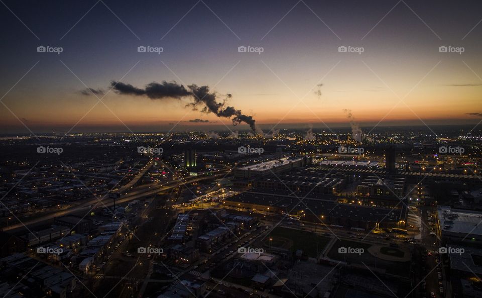 Sunset over South Philadelphia with view of the oil refinery in action 
