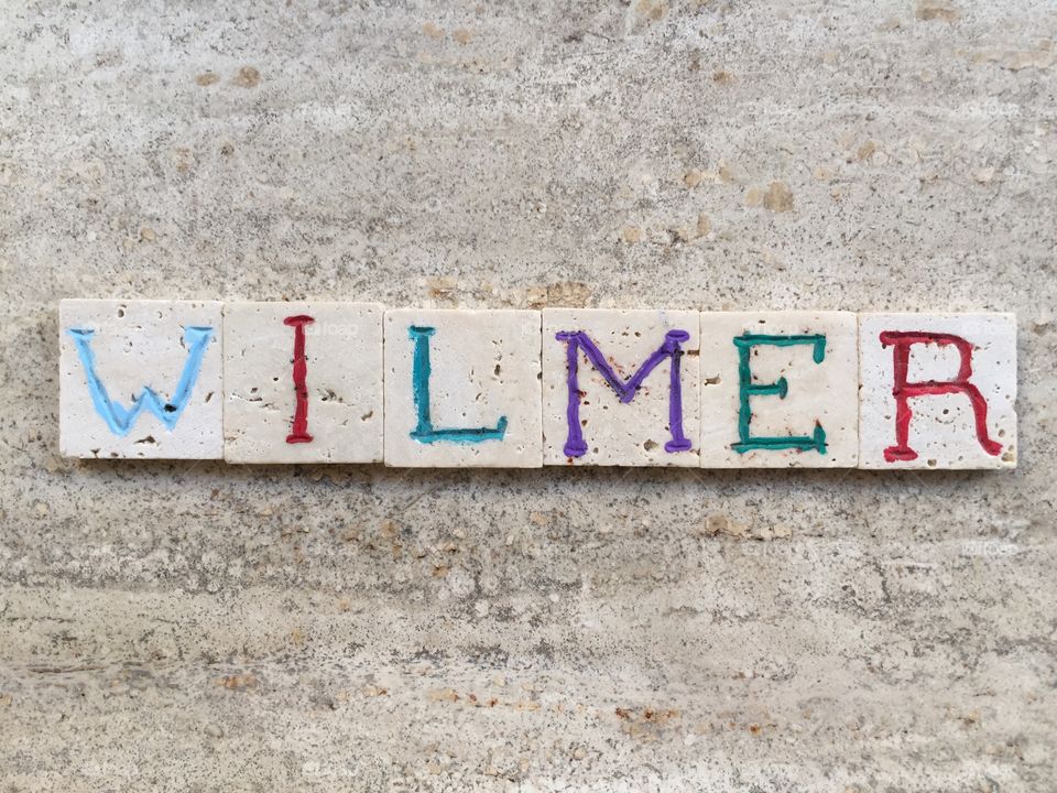 Wilmer, swedish male name . Composition with carved travertine pieces of Wilmer, swedish masculine name