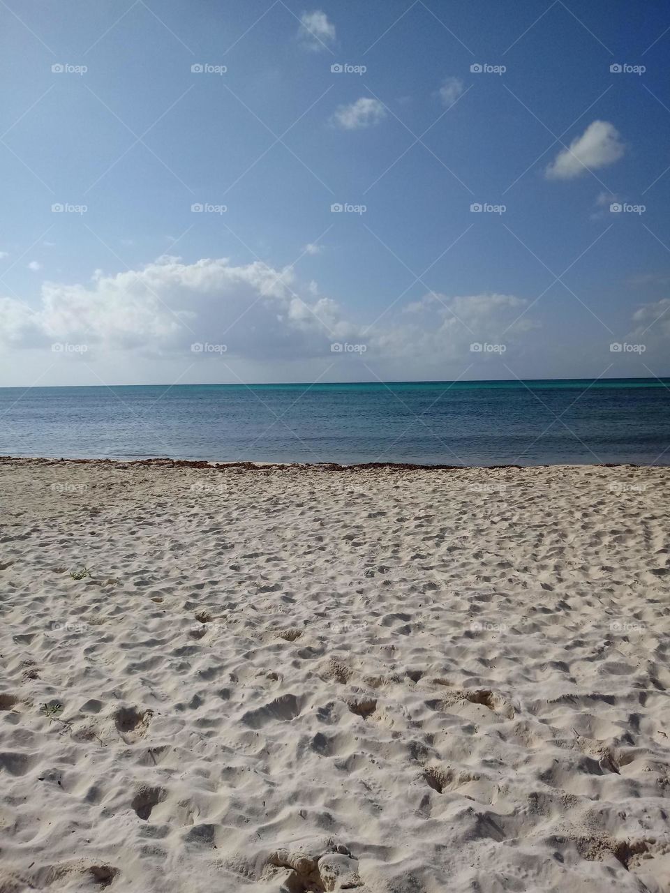 Sand and dark water on a beach 