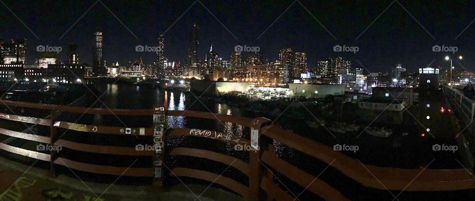 A large panoramic night shot of “New York City” presented again at higher resolution and a bit more close up. The LIC, Queens and the Manhattan skyline can be seen from the “Greenpoint”, Bklyn side of the “Pulaski Bridge”. 2023. Hypnotic Productions