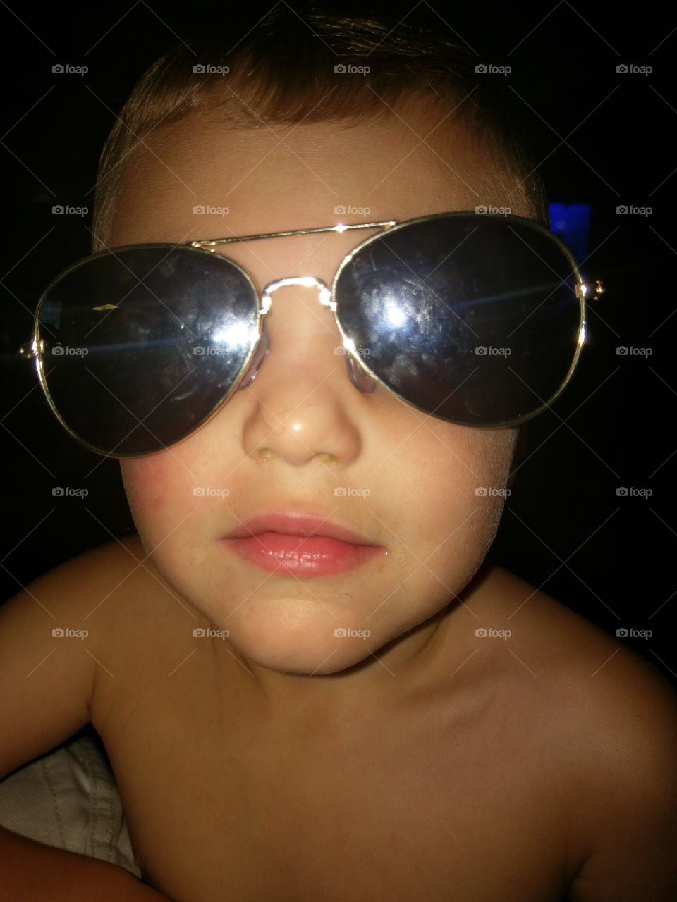 Little boy in Aviator glasses.