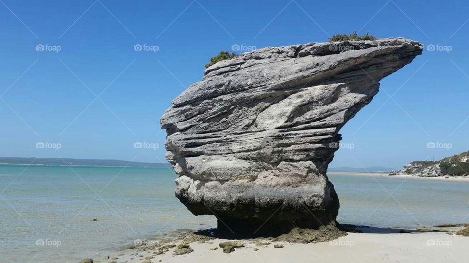 an exquisite rock formation on a beautiful remote island beach