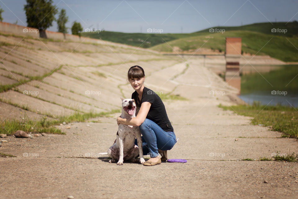 Girl playing with her dog