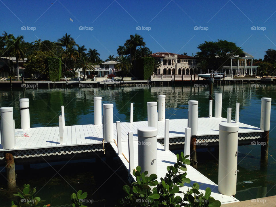 Pier in front of house on intracoastal waterway, Florida, USA 