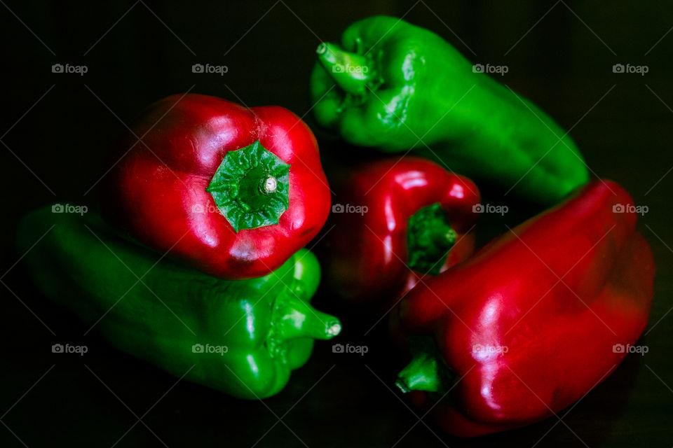 Picture of red and green peppers that looks like a painting.