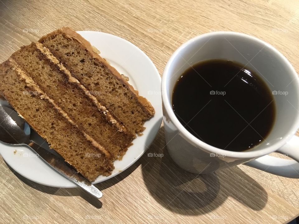 Black filter coffee with slice of coffee and walnut cake at the Waterfront Cafe, Benson, Oxfordshire 