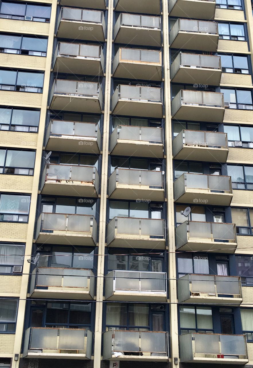 Apartment building balconies looking up