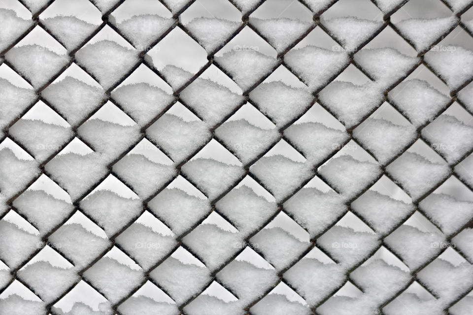 Snowy chain link fence