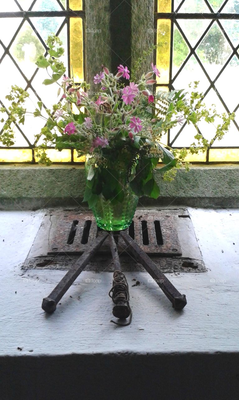 A symbolic display of wild flowers and crucifixion nails in an English church