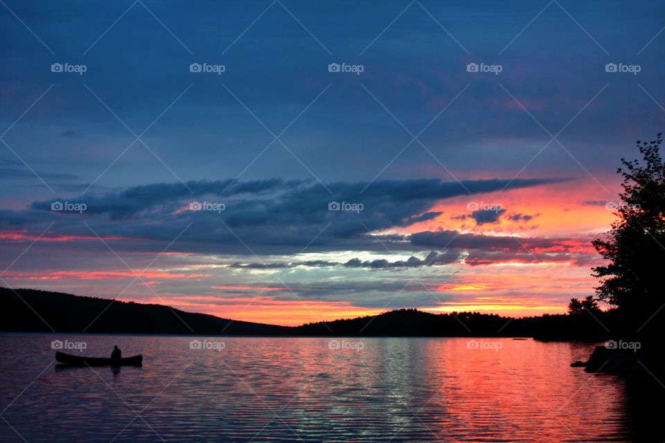 Canoe at Sunset. Canoe at sunset on Grand Lake in Algonquin Provincial Park. 