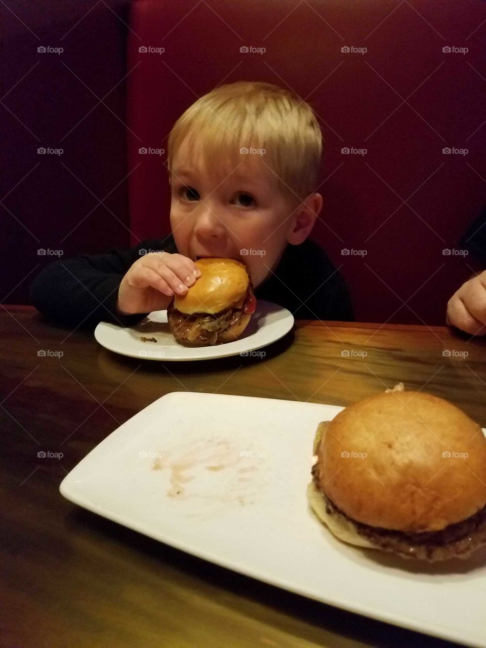 boy eating a burger