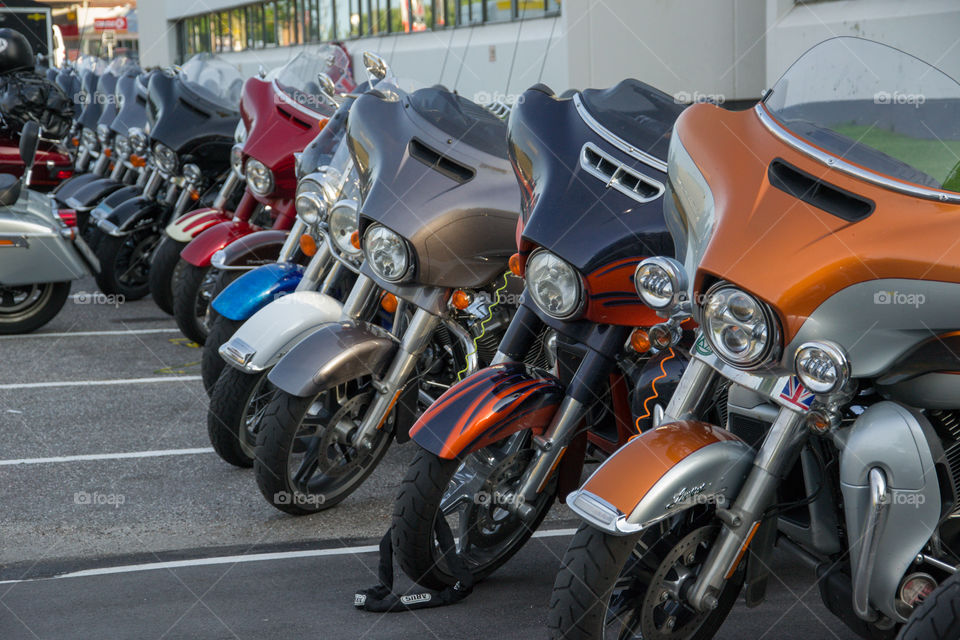 a large collection of motorcycles parked outside a hotel in Denmark.