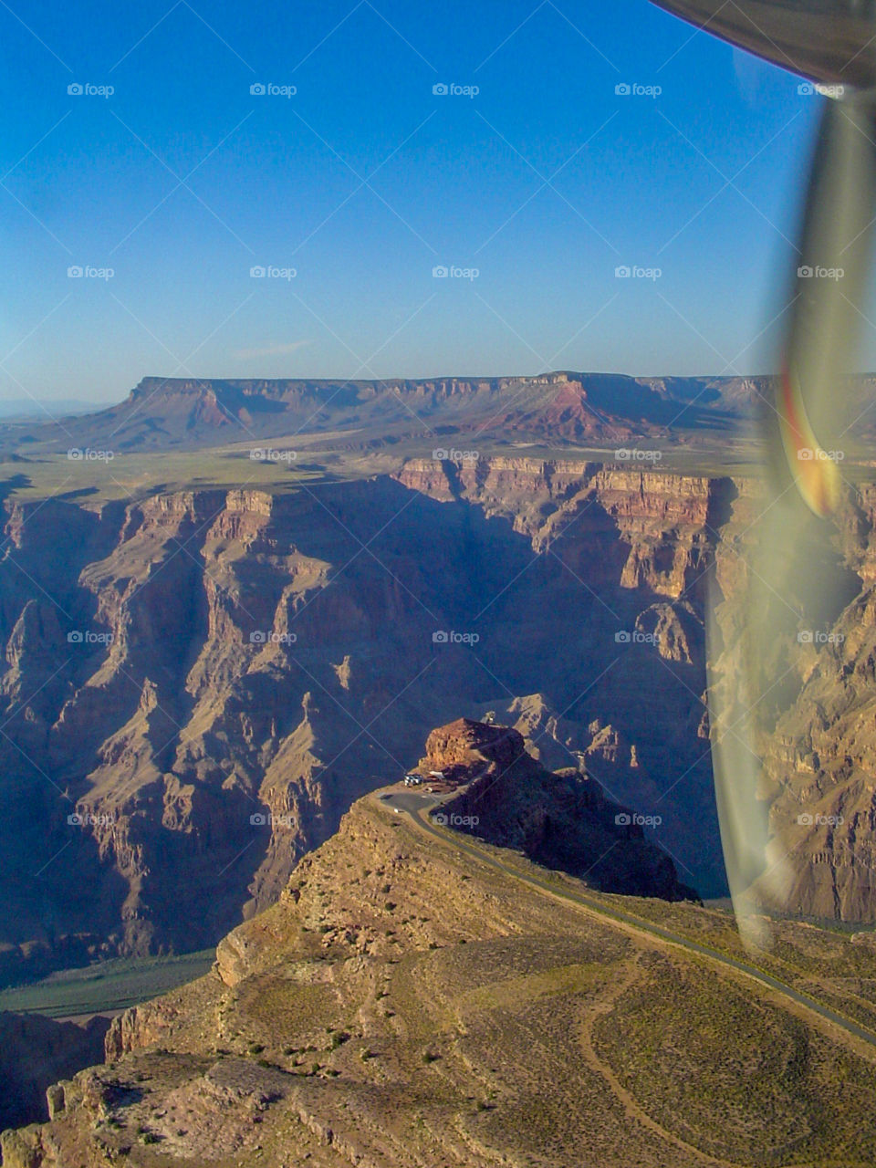 Small aircraft flying over
 the Grand Canyon ; amazing