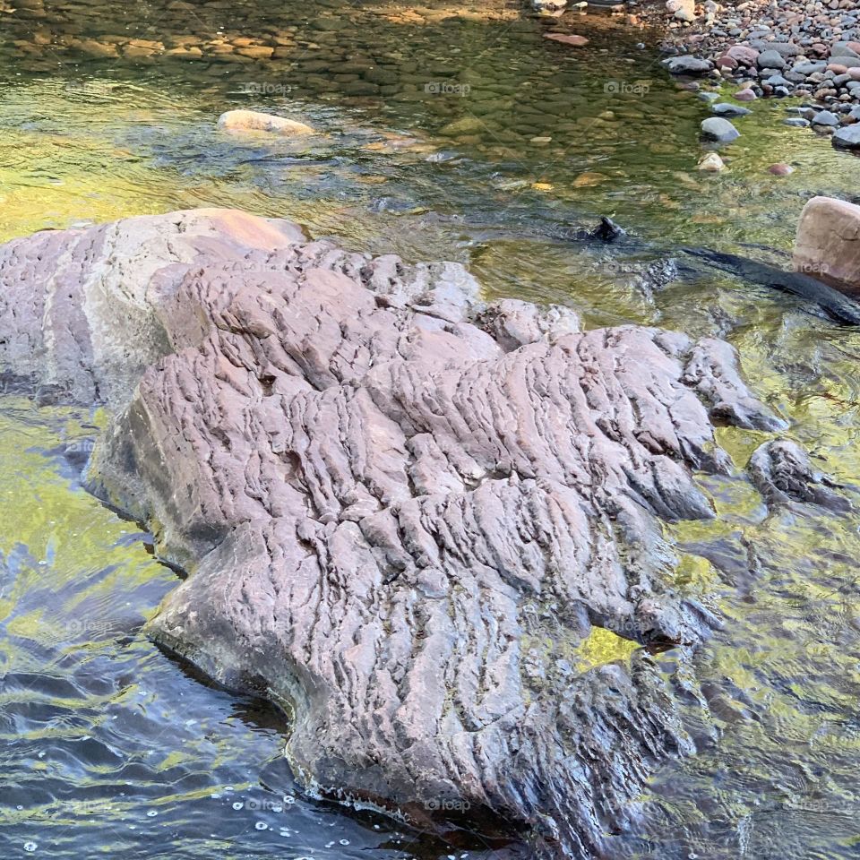 Inolvidable river’s flow, beautiful colorful waves and rocks formation.