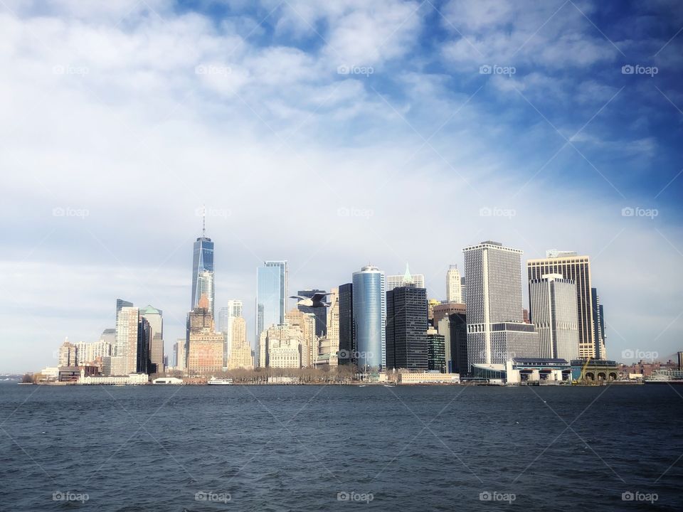 Lower Manhattan, New York, viewed from the ferry in a winter day.