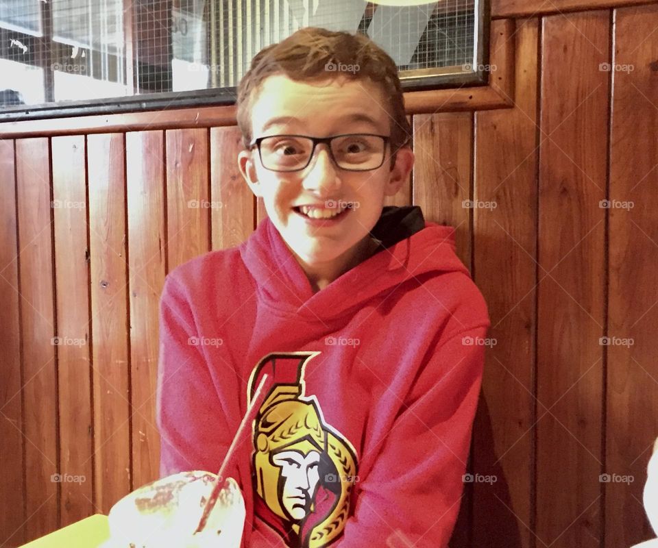 A young boy is surprised on his birthday.