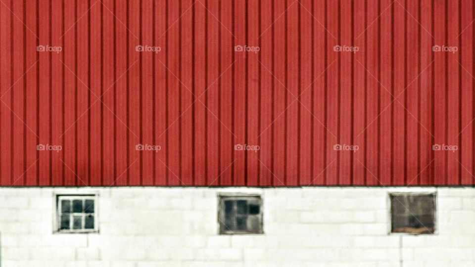 View of window in red and white wall