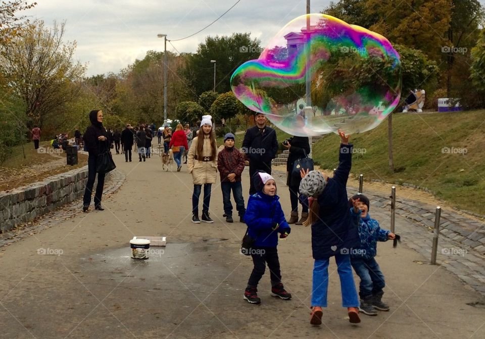 Children playing with bubbles