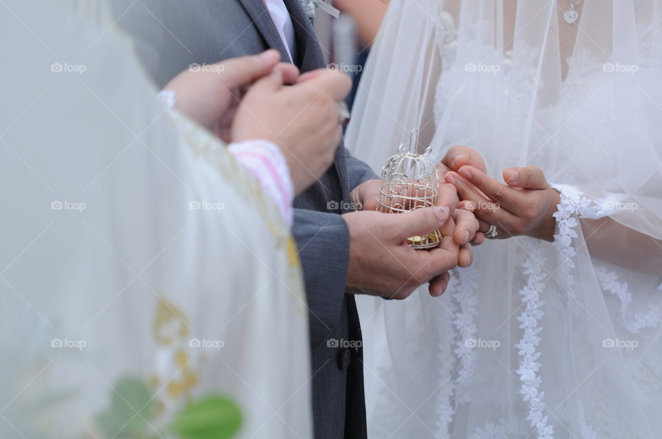 The giving of arrhae or unity coins of groom to his bride symbolizes his ability to support her.