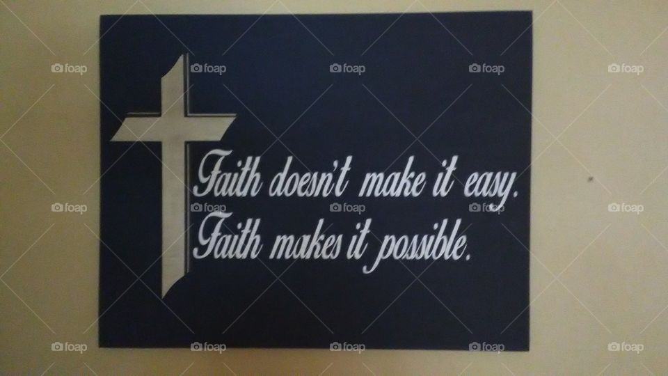 A one of a kind hand painted sign featuring a cross.