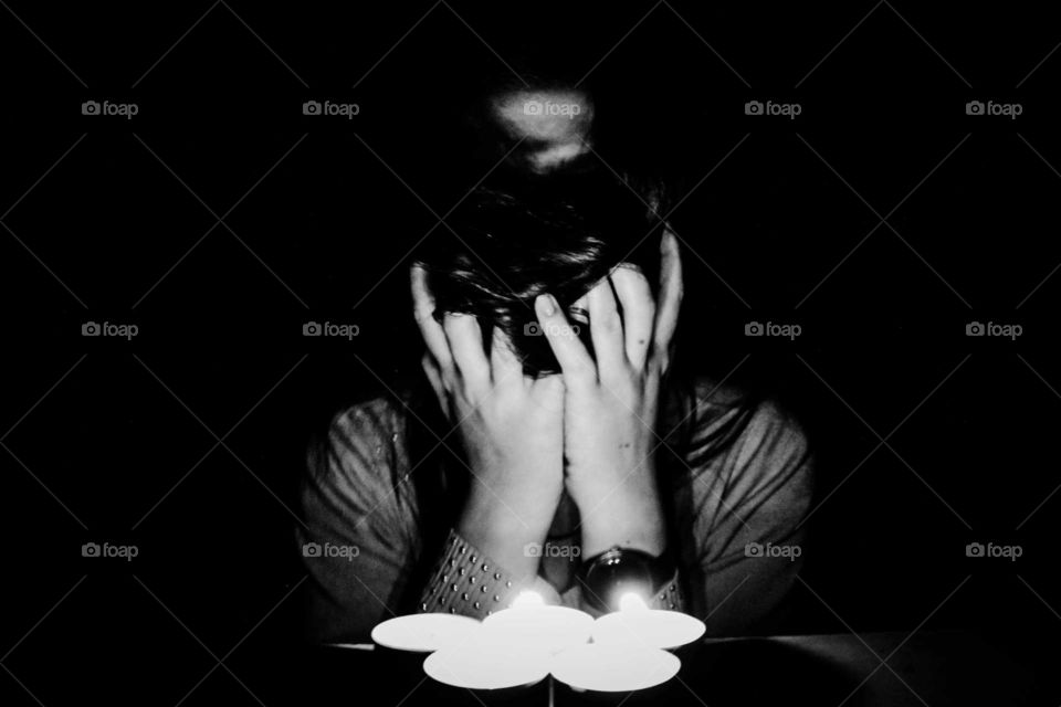 Candles and hands. Monochrome.