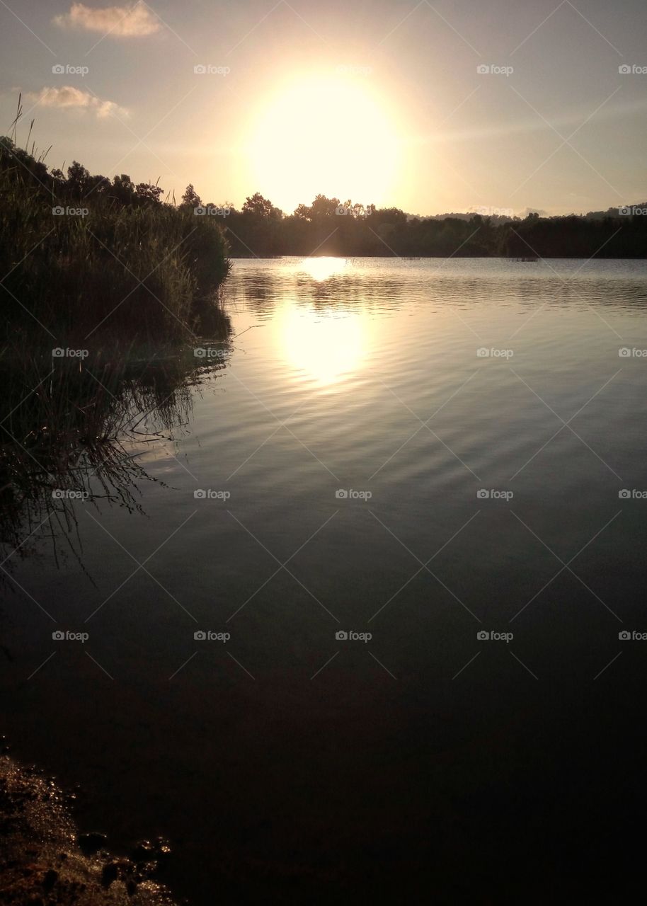 Golden hours sun at lake