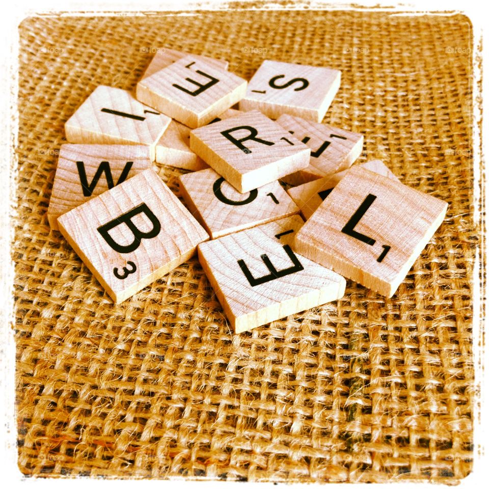 Letters. Pile of Scrabble tiles.