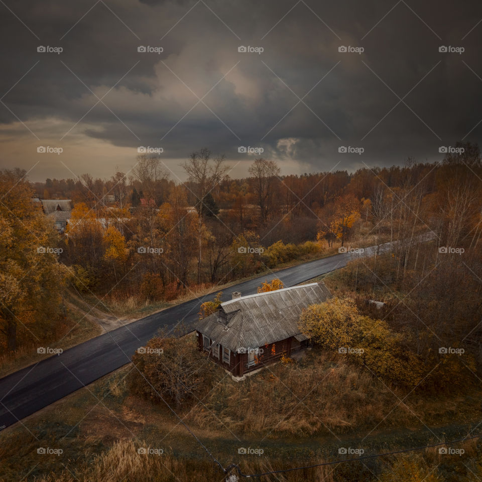 Aerial view on an autumn rural road 