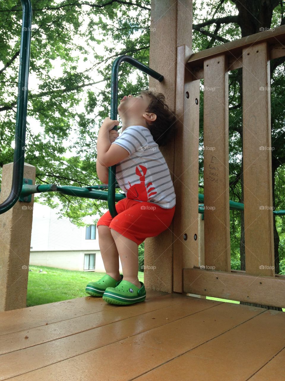 Toddler boy at the playground in summer.