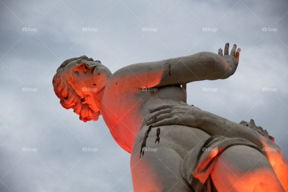 statue of a person in a garden