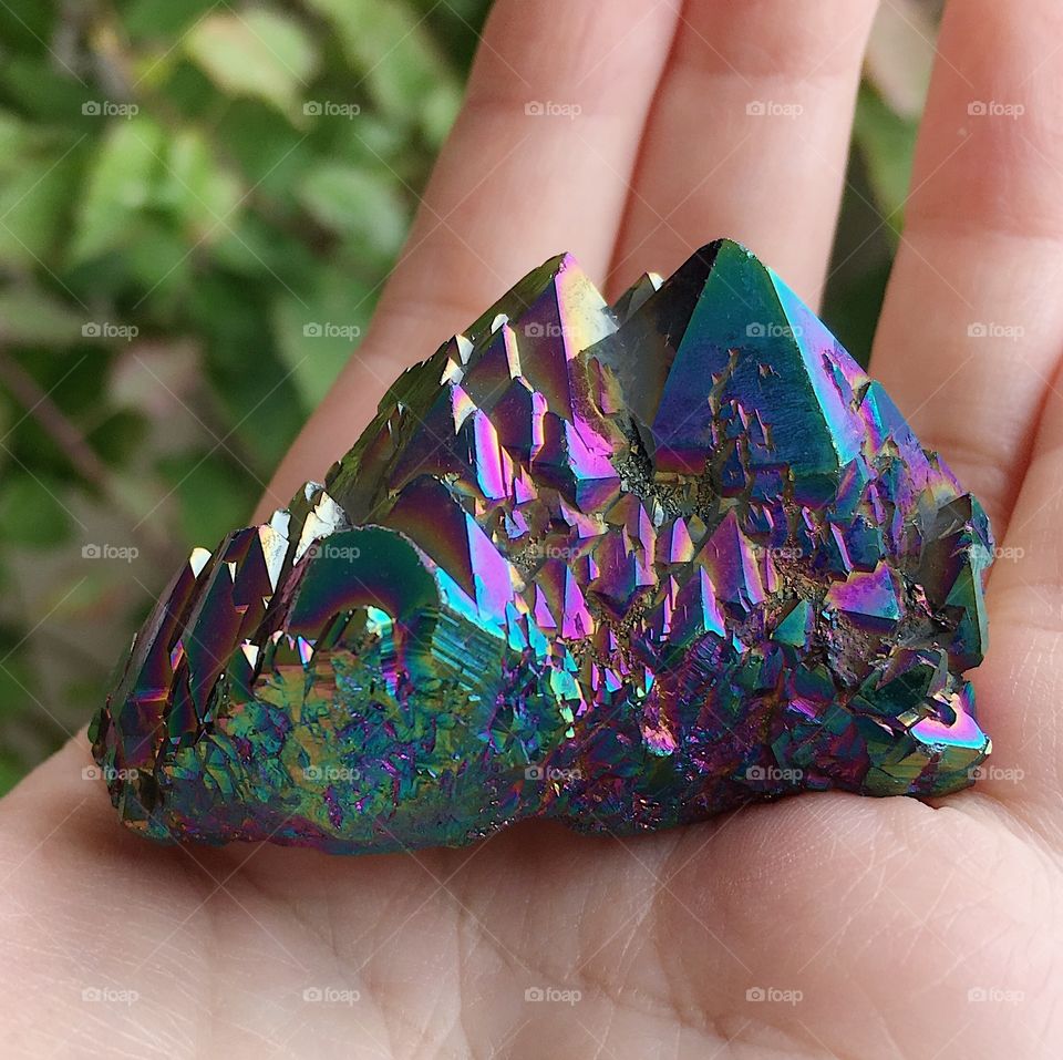 A rainbow aura quartz crystal.