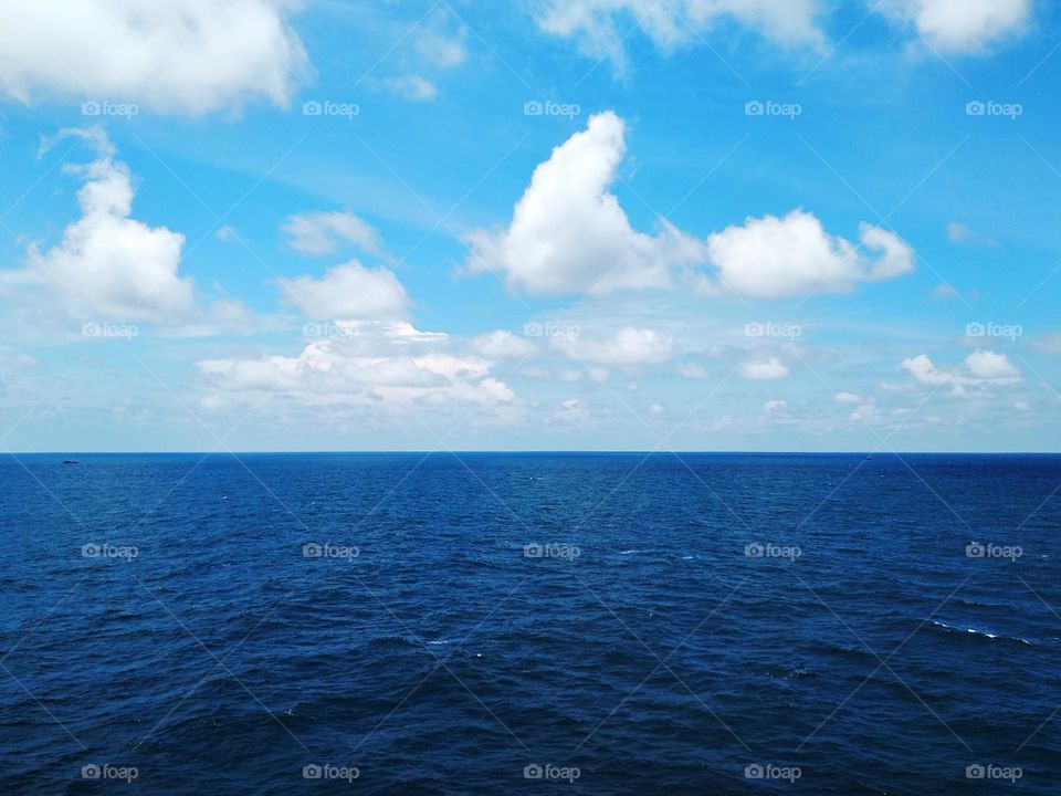 Cloudscape on the sea, the beauty of cumulus clouds combined with the softness of cirrus clouds.