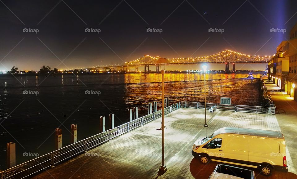 Route 90 across The Mississippi River by night, near the French Quarter, New Orleans, Louisiana, USA.