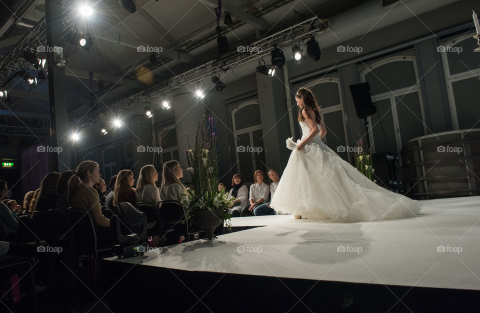 Fashion show at a wedding fair. Here are the latest dresses and clothes for both bride and groom.