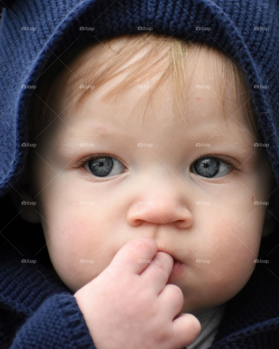 Cute baby boy in blue sweater
