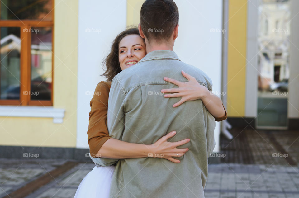 Love story of stylish funny couple. People walking, dancing and kissing in the autumn city. Wedding celebration and date concept.