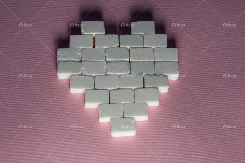 Sugar cubes in heart shape. Creative valentine concept
