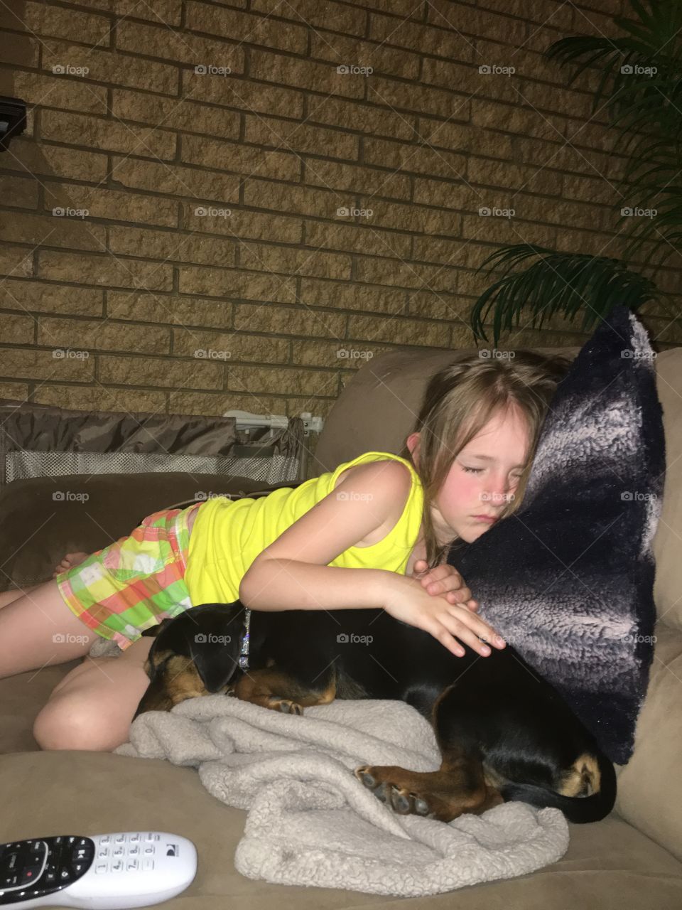 Girl sleeping with her dog