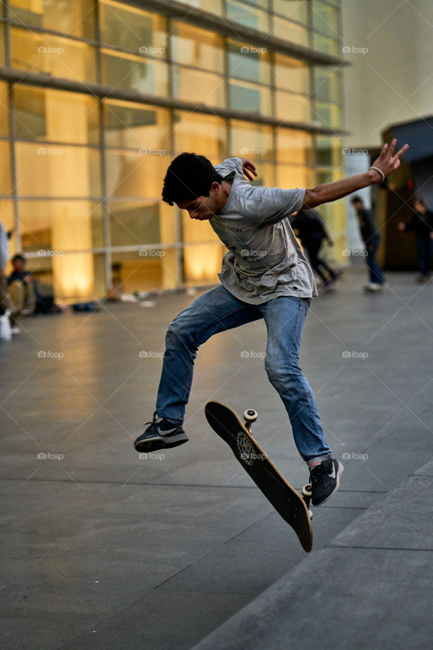 Evening Colorful Backlights over a Skater