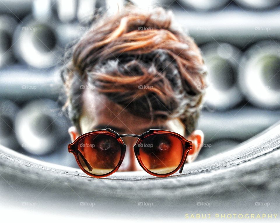 A man watching sunglasse