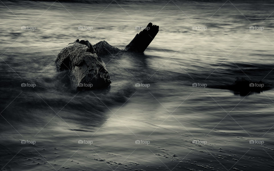 Coastal long exposure of water retracting monochrome 