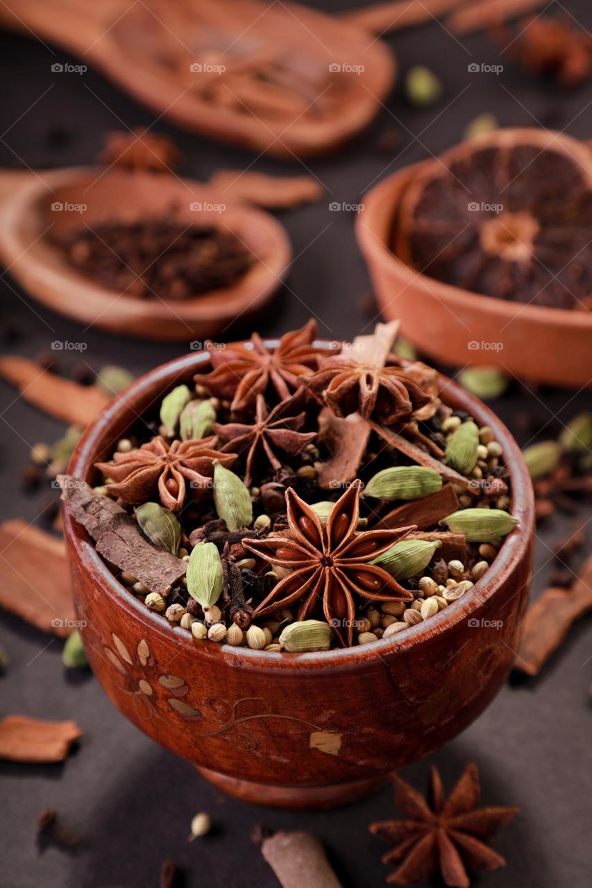 Indian spices in a wooden bowl