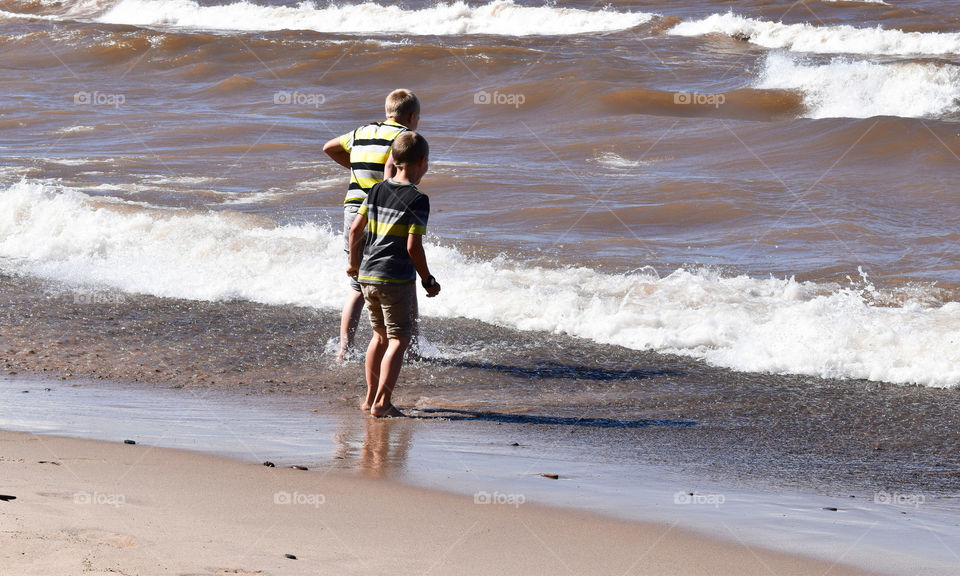 Playing in the surf along Lake Superior