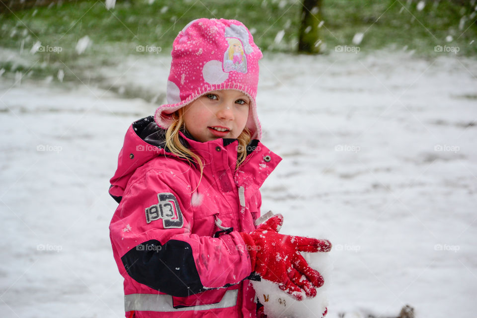 Five year old girl playing in the snow in Malmö Sweden.