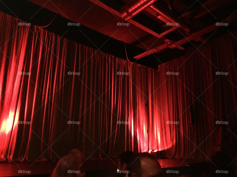 Photo of stage with closed curtains