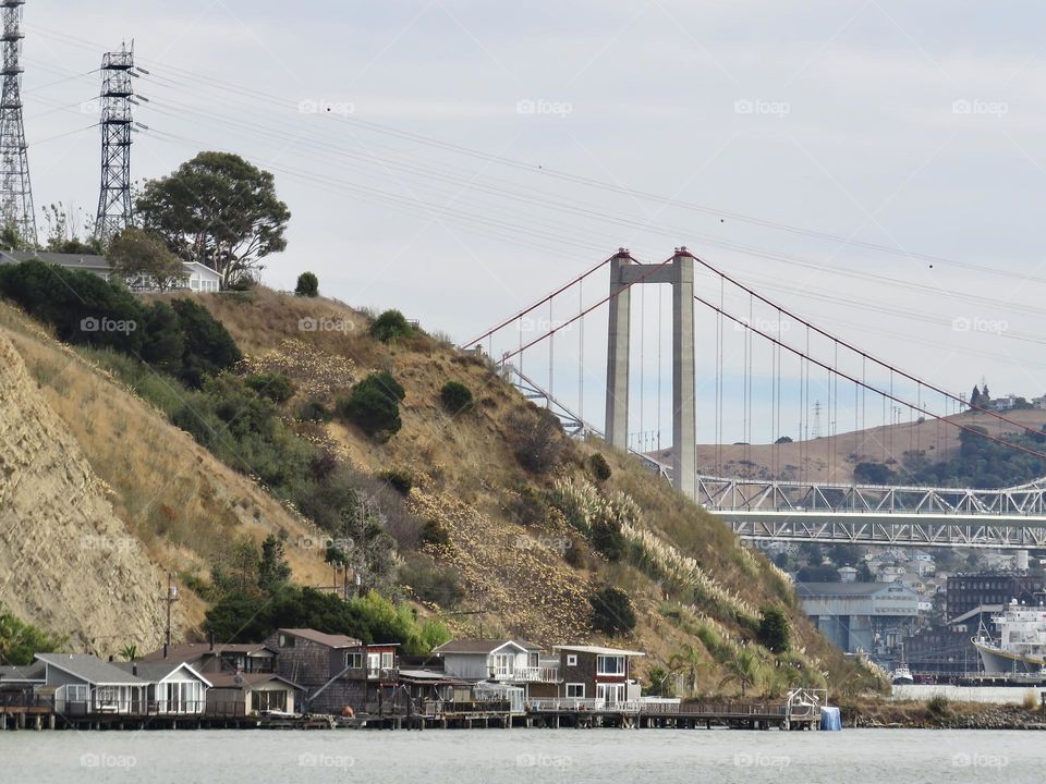 Floating Homes with a Bridge in the Background 