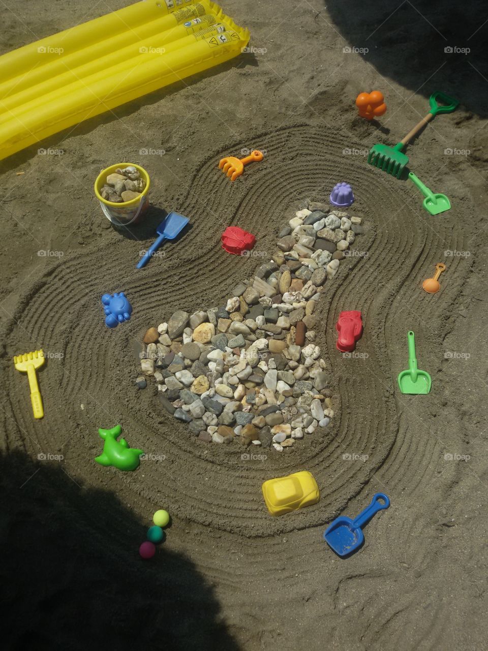 tree made of rocks on beach