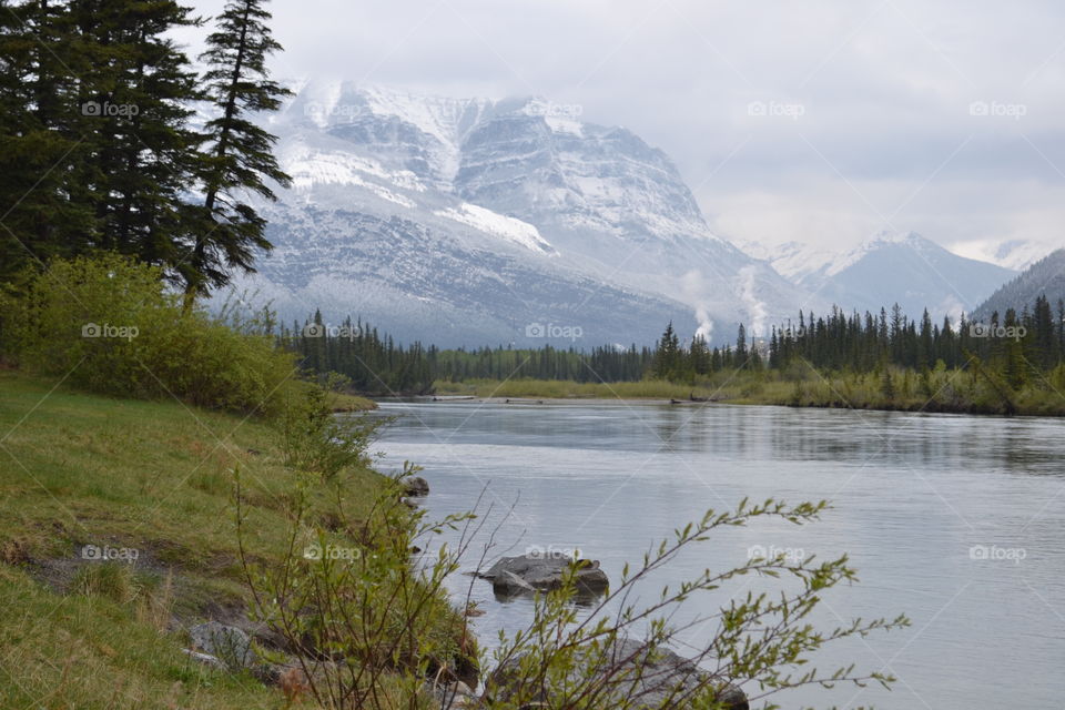 Scenic view of snowy mountain and lake